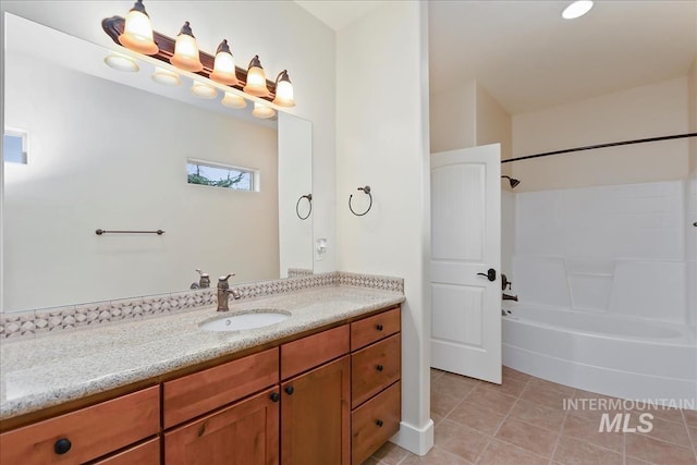 bathroom with  shower combination, vanity, and tile patterned flooring