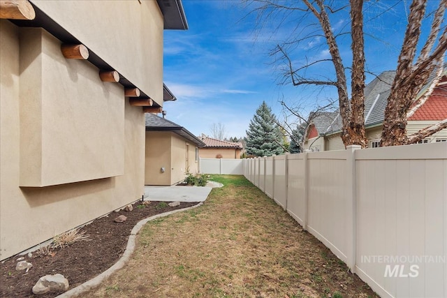 view of yard with a fenced backyard