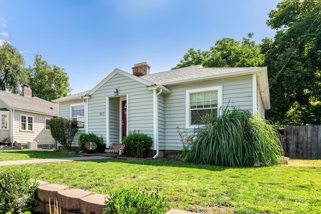 907 3rd St, Lewiston, ID 83501 - bungalow-style home with a chimney and roof with shingles