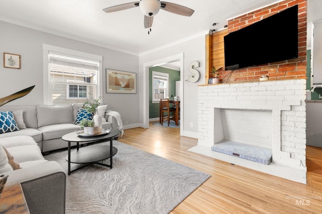 907 3rd St, Lewiston, ID 83501 - living area with wood finished floors, crown molding, and ceiling fan