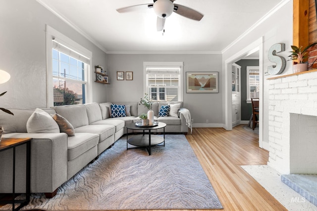 907 3rd St, Lewiston, ID 83501 - living area featuring a ceiling fan, light wood-style flooring, ornamental molding, and a fireplace