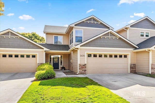 2476 S Amaya Ln, Boise, ID 83709 - view of front facade featuring driveway, stone siding, an attached garage, and a front yard