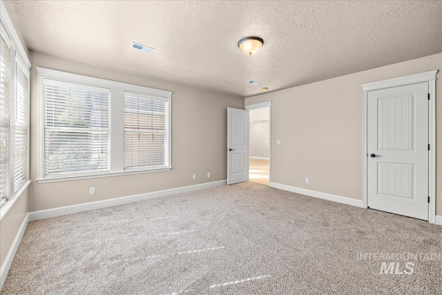 2476 S Amaya Ln, Boise, ID 83709 - unfurnished bedroom with carpet floors, a textured ceiling, and baseboards