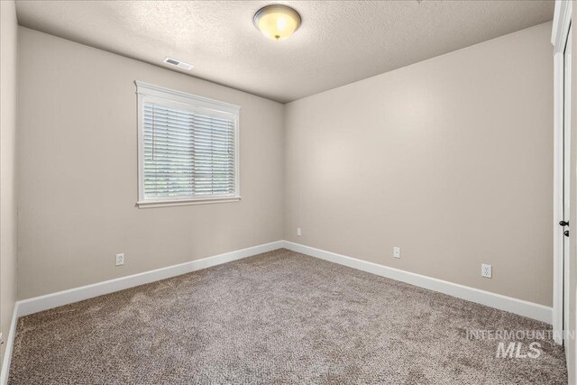2476 S Amaya Ln, Boise, ID 83709 - carpeted empty room featuring a textured ceiling and baseboards