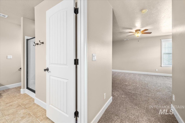 2476 S Amaya Ln, Boise, ID 83709 - hall featuring a textured ceiling, baseboards, and light carpet