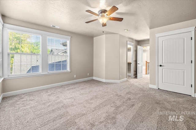 2476 S Amaya Ln, Boise, ID 83709 - unfurnished bedroom featuring carpet floors, a textured ceiling, baseboards, and a ceiling fan