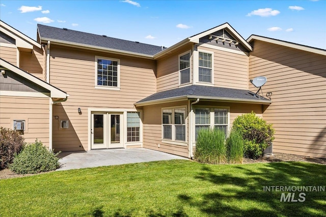 2476 S Amaya Ln, Boise, ID 83709 - back of house featuring a patio area and a lawn