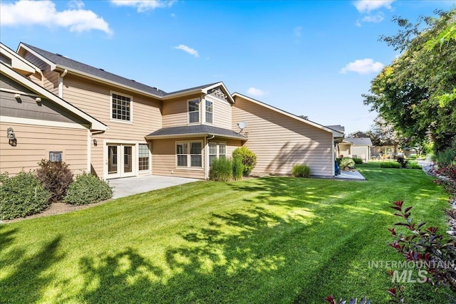 2476 S Amaya Ln, Boise, ID 83709 - back of property with a lawn and a patio