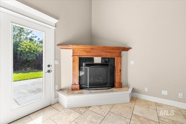 2476 S Amaya Ln, Boise, ID 83709 - detailed view of a tiled fireplace and baseboards