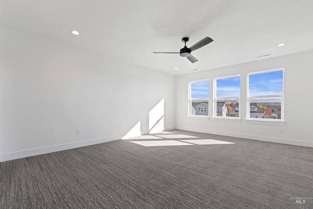 2358 E Monhegan Dr, Eagle, ID 83616 - spare room with a ceiling fan, baseboards, dark colored carpet, and recessed lighting