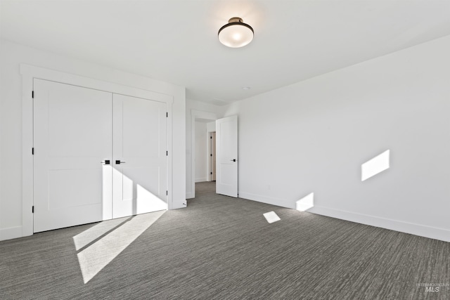 2358 E Monhegan Dr, Eagle, ID 83616 - unfurnished bedroom featuring carpet, a closet, and baseboards
