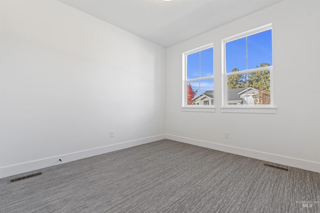 2358 E Monhegan Dr, Eagle, ID 83616 - spare room featuring baseboards and dark carpet