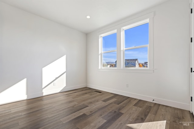 2358 E Monhegan Dr, Eagle, ID 83616 - unfurnished room featuring baseboards, wood finished floors, and recessed lighting