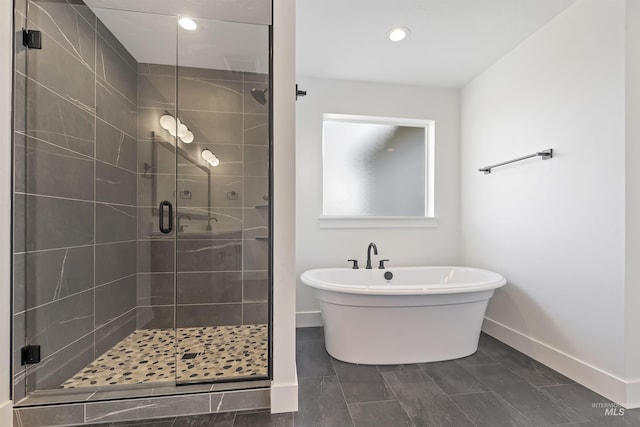 2358 E Monhegan Dr, Eagle, ID 83616 - full bath featuring baseboards, a stall shower, a freestanding tub, and recessed lighting