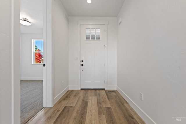 2358 E Monhegan Dr, Eagle, ID 83616 - foyer entrance with wood finished floors and baseboards