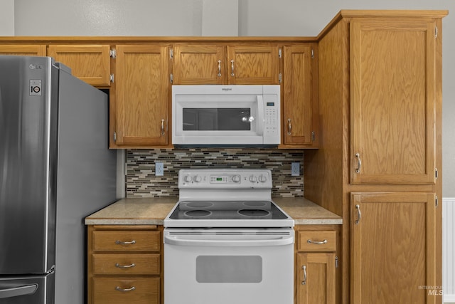 kitchen with tasteful backsplash and white appliances