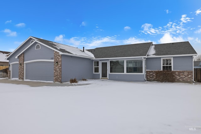 ranch-style house featuring a garage