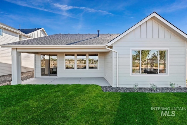 back of property featuring a lawn and a patio area