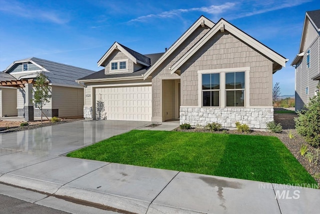 view of front of property with a garage and a front lawn