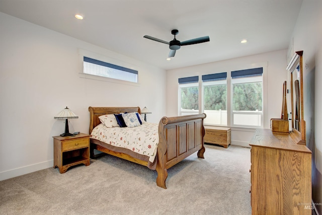 bedroom with light colored carpet and ceiling fan