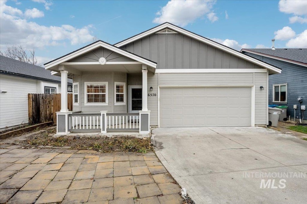 view of front of house featuring a garage and covered porch