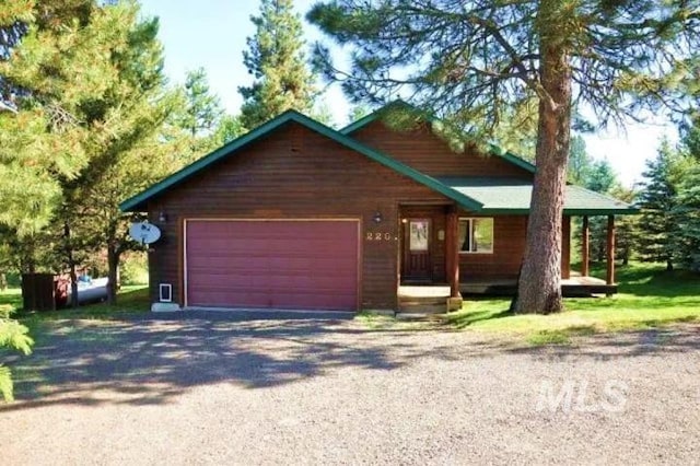 view of front of property featuring an attached garage and driveway