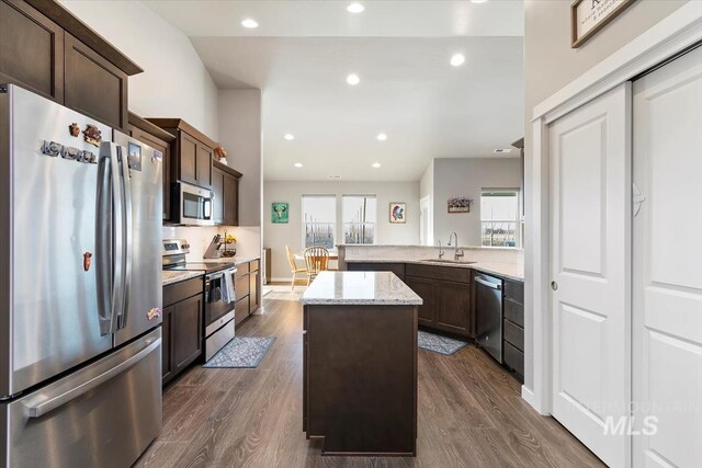 22924 Fargo Rd, Parma, ID 83660 - kitchen featuring a center island, a sink, appliances with stainless steel finishes, and dark wood-style flooring