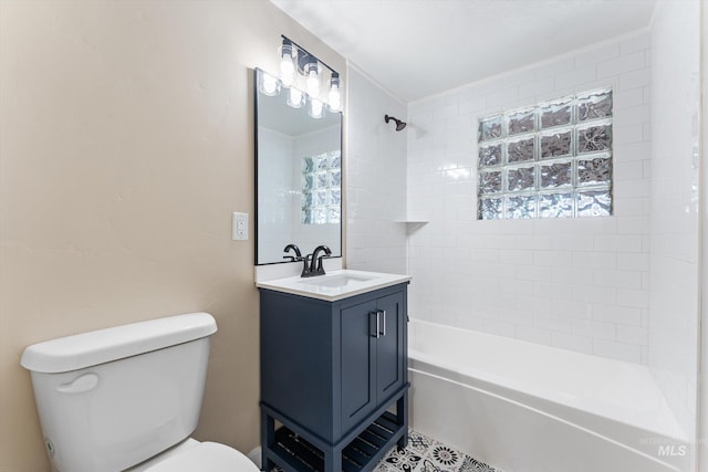 bathroom featuring toilet, vanity, and shower / tub combination