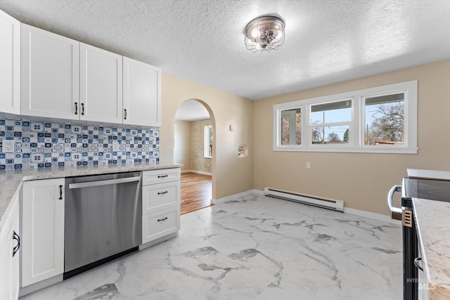 kitchen with stainless steel dishwasher, plenty of natural light, arched walkways, and a baseboard heating unit