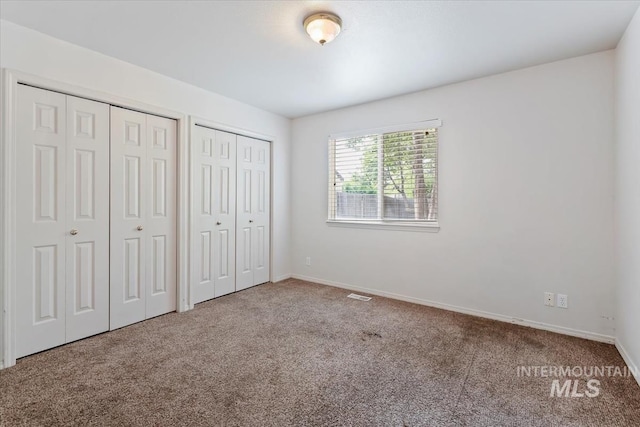 10795 W Susan St, Boise, ID 83713 - unfurnished bedroom with multiple closets and carpet