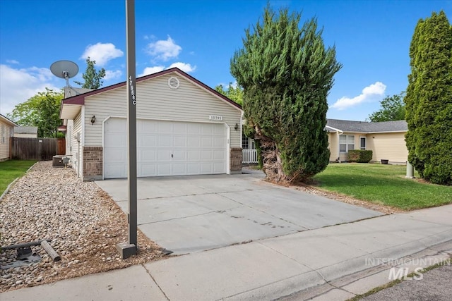 10795 W Susan St, Boise, ID 83713 - view of front of house with brick siding, concrete driveway, and a garage