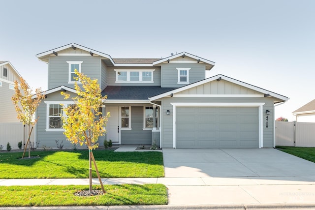 view of front of home with an attached garage, concrete driveway, roof with shingles, board and batten siding, and a front yard