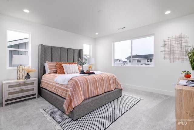 bedroom featuring light carpet, baseboards, visible vents, and recessed lighting