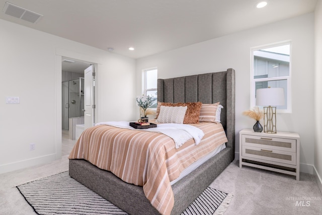 bedroom with recessed lighting, visible vents, light carpet, and baseboards