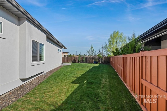 view of yard featuring a fenced backyard
