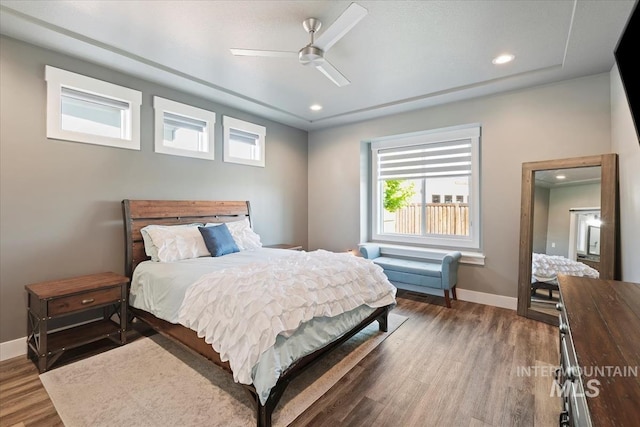 bedroom with recessed lighting, baseboards, a ceiling fan, and wood finished floors