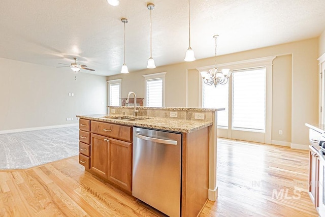 7053 W Butte Ln, Boise, ID 83704 - kitchen featuring stainless steel dishwasher, a sink, light wood-type flooring, a chandelier, and a ceiling fan