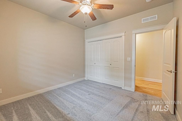 7053 W Butte Ln, Boise, ID 83704 - unfurnished bedroom with carpet flooring, baseboards, a closet, vaulted ceiling, and ceiling fan