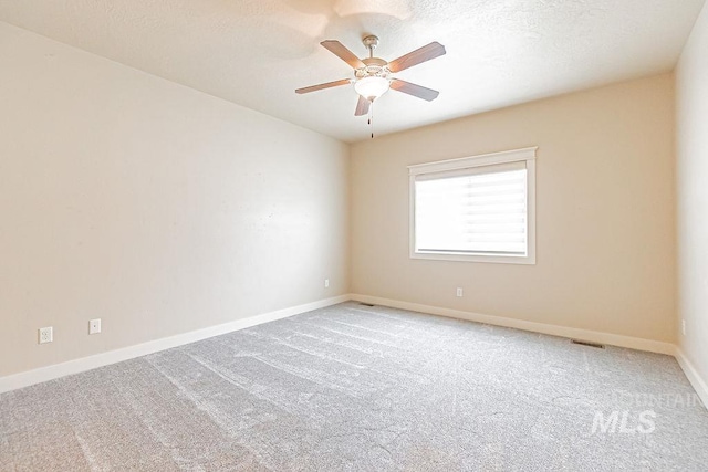 7053 W Butte Ln, Boise, ID 83704 - empty room featuring carpet, baseboards, and a ceiling fan