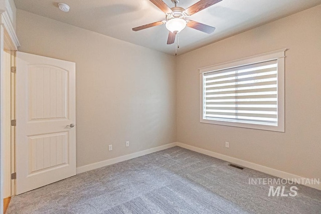 7053 W Butte Ln, Boise, ID 83704 - carpeted spare room with a smoke detector, baseboards, and a ceiling fan