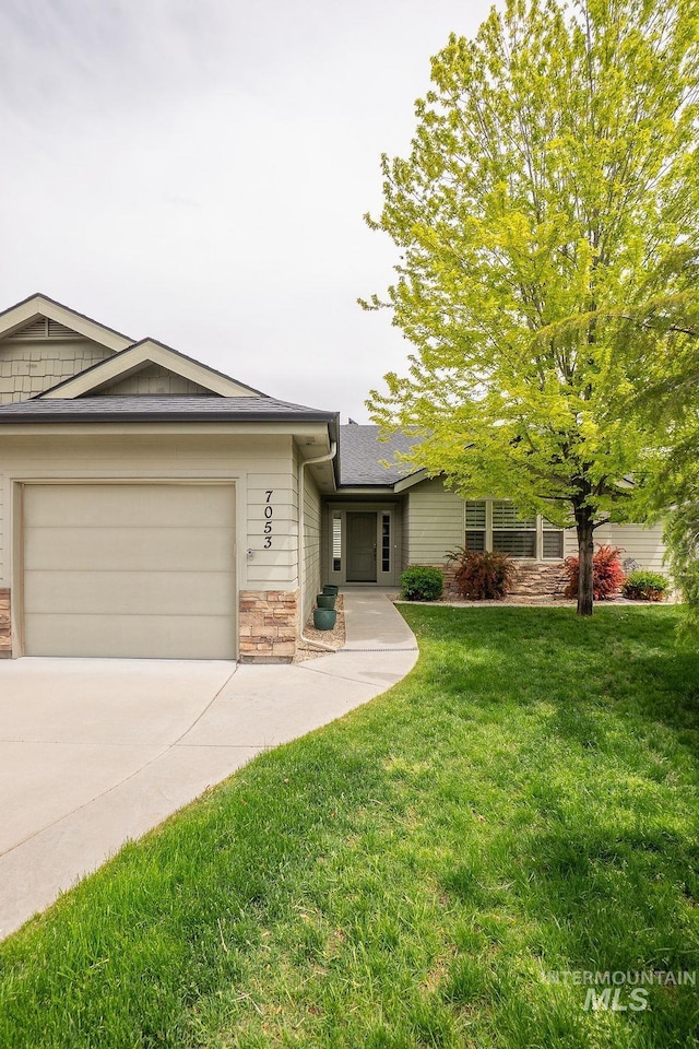 7053 W Butte Ln, Boise, ID 83704 - ranch-style home featuring stone siding, driveway, a front lawn, a garage, and roof with shingles