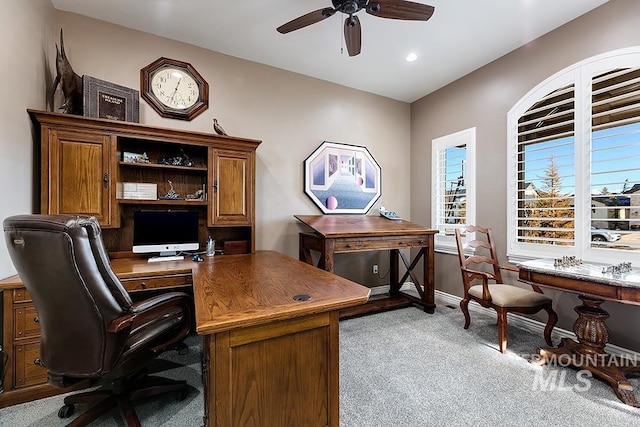 home office with ceiling fan and light colored carpet