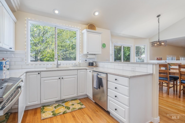 kitchen featuring electric range, tasteful backsplash, stainless steel dishwasher, light wood finished floors, and a peninsula
