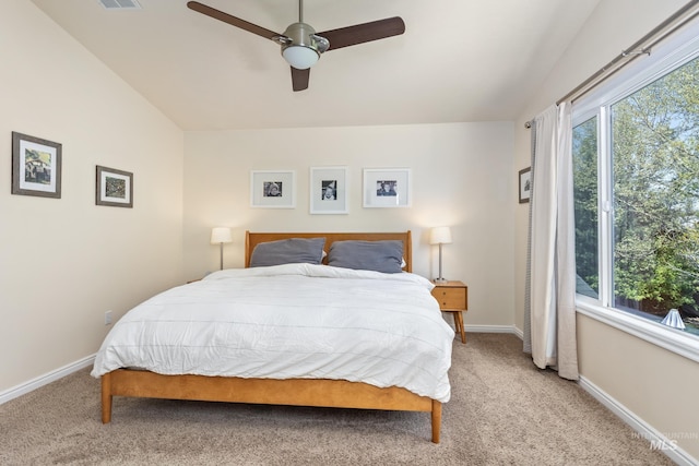 bedroom with baseboards, visible vents, ceiling fan, and light colored carpet