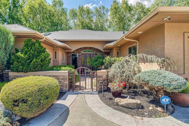 705 N Cobblestone Way, Eagle, ID 83616 - view of exterior entry with a gate and stucco siding