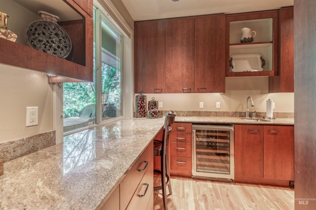 705 N Cobblestone Way, Eagle, ID 83616 - indoor wet bar featuring wine cooler and light wood-type flooring