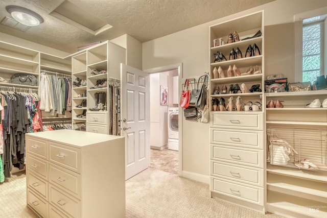 705 N Cobblestone Way, Eagle, ID 83616 - walk in closet featuring light carpet and washer / clothes dryer