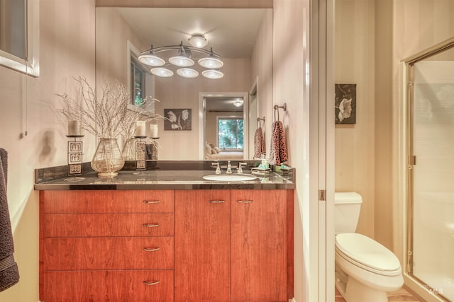 705 N Cobblestone Way, Eagle, ID 83616 - bathroom featuring a shower stall, vanity, and toilet