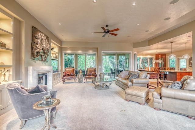 705 N Cobblestone Way, Eagle, ID 83616 - living room with carpet flooring, ceiling fan, recessed lighting, plenty of natural light, and a high end fireplace