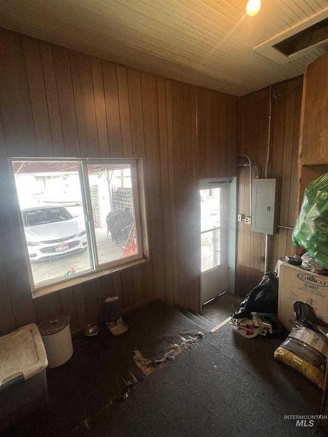 285 SW 3rd St, Ontario, OR 97914 - miscellaneous room featuring electric panel, wood walls, and carpet